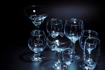 Empty  glasses for drinks on dark background