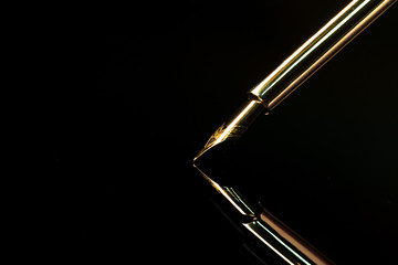 Close up of a pen on black background