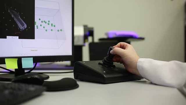 Quality engineer scanning some moldings by professional optical 3D scanner with a turntable, metrology concept