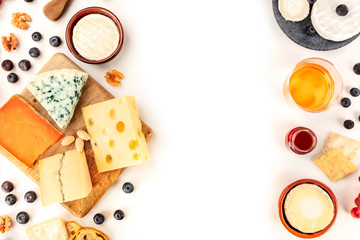 Cheese design, an overhead shot on a white background with a place for text. A variety of cheeses...