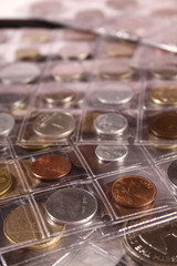 Many coins of different countries and times. Numismatics