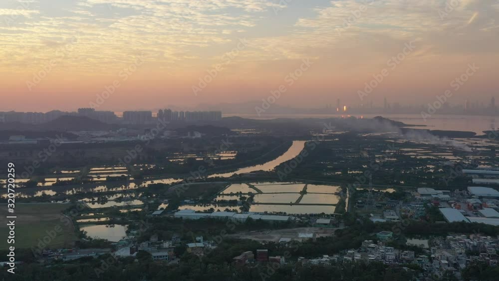 Poster Aerial View of rural green fields in Hong Kong border and skylines in Shenzhen, China