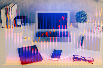 Financial graph colorful drawing and table with computer on background. Double exposure. Concept of international markets.