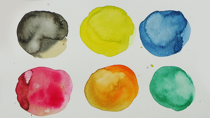 Watercolor hand painted circle shape design elements. Set of multicolored watercolor dots