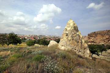 Fototapeta na wymiar Unusual stones from volcanic rocks in the Red Valley near the village of Chavushin in the Cappadocia region in Turkey.
