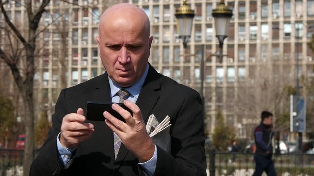 Businessman Text on Mobile Phone and Read Financial Messages, Manager Image Using a Cellphone for Online Communication