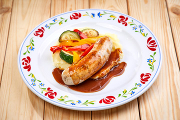 sausage with mashed potato and vegetables