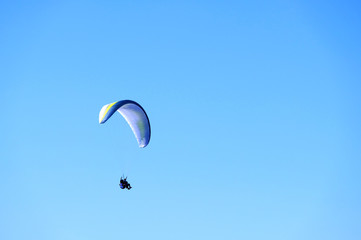 paragliding in the blue sky