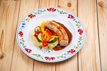sausage with mashed potato and vegetables