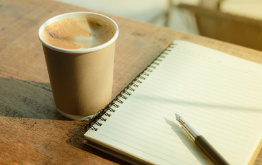 hot latte coffee photography with milk froth in craft paper coffee cup