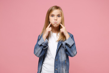 Little blonde kid girl 12-13 years old in denim jacket isolated on pastel pink background children...