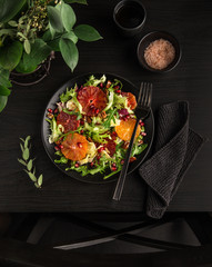orange salad on black table