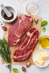 fresh raw beef steaks with ingredients