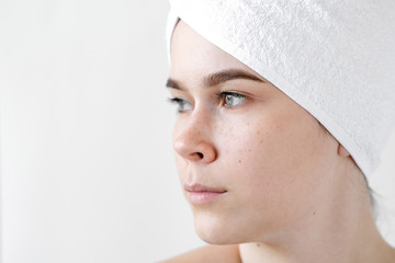 Young Woman with white Towels. Spa, skincare, beauty, cosmetics, wellness concept