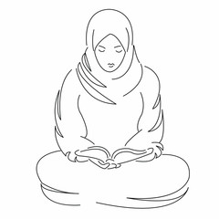 Muslim woman reads the Koran prays