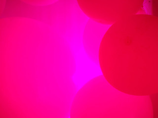 pink background made of neon balls.