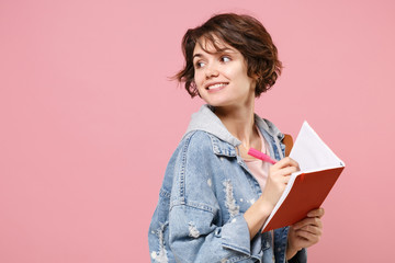 Side view of pretty girl student in denim clothes backpack isolated on pink background. Education...