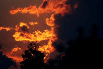 Fototapeta na wymiar Golden hour red sunset clouds