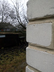 Corner of a white silicate brick house