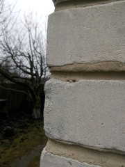 Corner of a white silicate brick house
