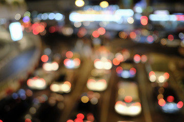 Blured of Heavy traffic Jam at the night time in bangkok. with circular bokeh. space for text. with selective focus