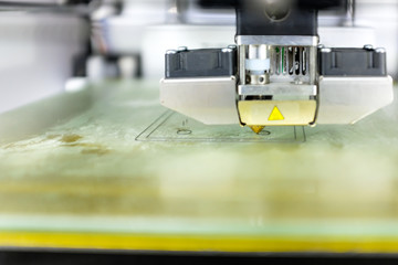 Modern 3D Printer Machine Printing Figure Close-up. Macro Photography of 3D Printing Technology.