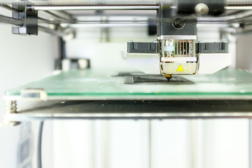 Modern 3D Printer Machine Printing Figure Close-up. Macro Photography of 3D Printing Technology.