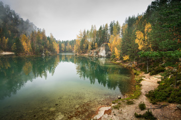 Fototapeta na wymiar Foggy lake during the autumn, scenic nature landscape, mountain lake, clean water, tourism destination