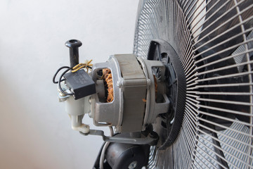 Close-up motor fan Repair and maintenance of home appliances for fixing the fan,  nut and wire copper roll of motor fan onbackground .