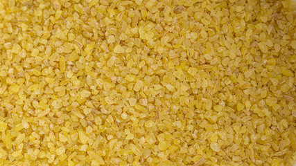 Bulgur groats background. Macro photo. 