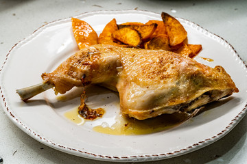 Homemade Healthy Organic Baked Chicken Leg with Sweet Potatoes served in Plate.
