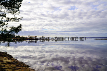 Sanguinet sandy beach water image miror reflection in landes france