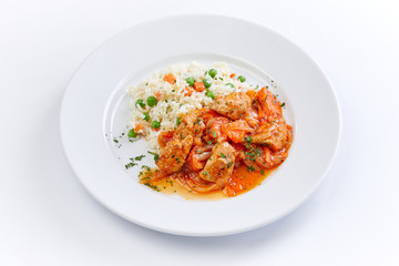 chicken with barley on teh white plate