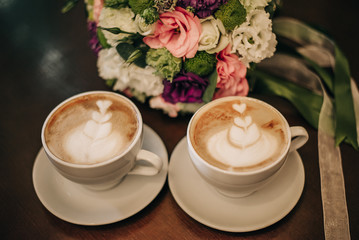 Coffee with milk in white cups.
