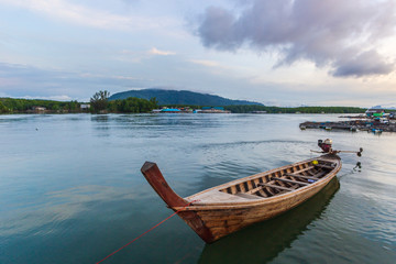 Long tail boat in Samchong Canal at Phang Nga, Thailand.