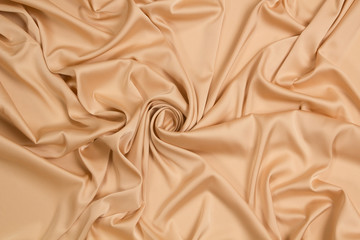Fabric satin silk drapery. Gold textile