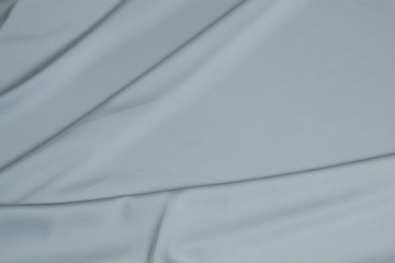 Fabric satin silk drapery. Blue textile