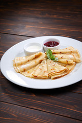 pancakes with sour cream and berry sauce