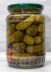 pickled cucumbers in glass jar