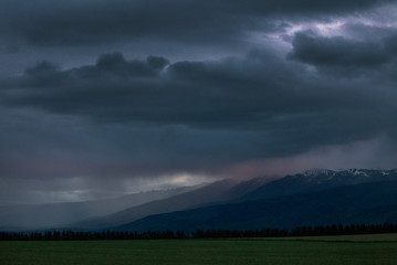 Obraz na płótnie Canvas Tarras. Cromwell New Zealand. Dark Thunderclouds. Twilight. Sunset