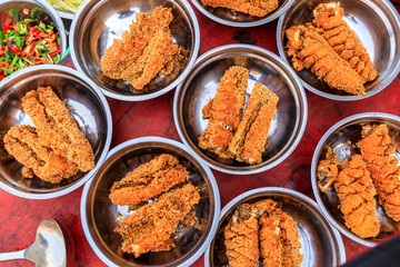 Delicious fried dried fish pieces,food background.
