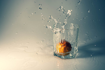 Mandarin in a glass with water
