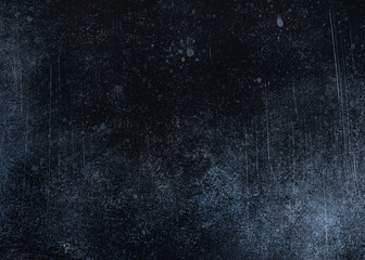 Elegant dark blue vintage grunge with scratches and cracks for design art work. Abstract background or texture.