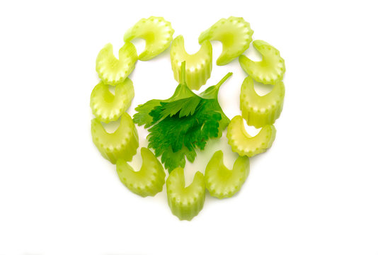 Fresh Organic Slice Green Celery Put In Heart Shape  With Leaves In Center Isolated On White Background