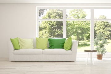 Stylish room in white color with sofa and summer landscape in window. Scandinavian interior design. 3D illustration