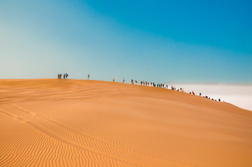 Fototapeta na wymiar Desert Sand Dunes and People