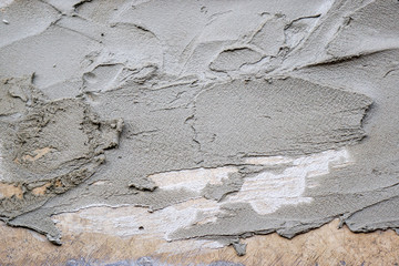 Closeup and crop wet cement texture on  construction site building wall background.