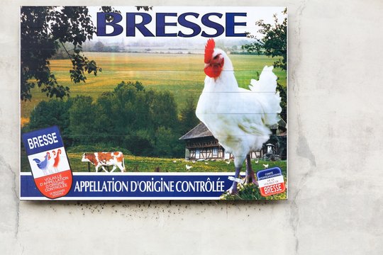 Vonnas, France - May 22, 2018: Advertisement for the famous Bresse chicken on a wall. The Bresse is a French chicken product which has appellation d'origine controlee status