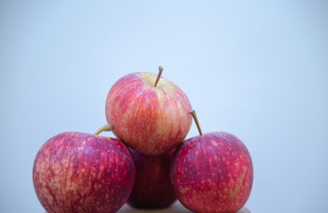A pile of apples serenated with dew