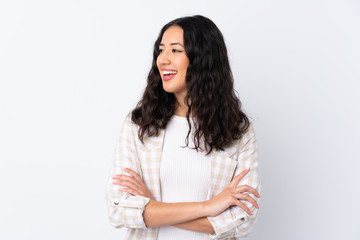 Fototapeta premium Mixed race woman over isolated white background happy and smiling